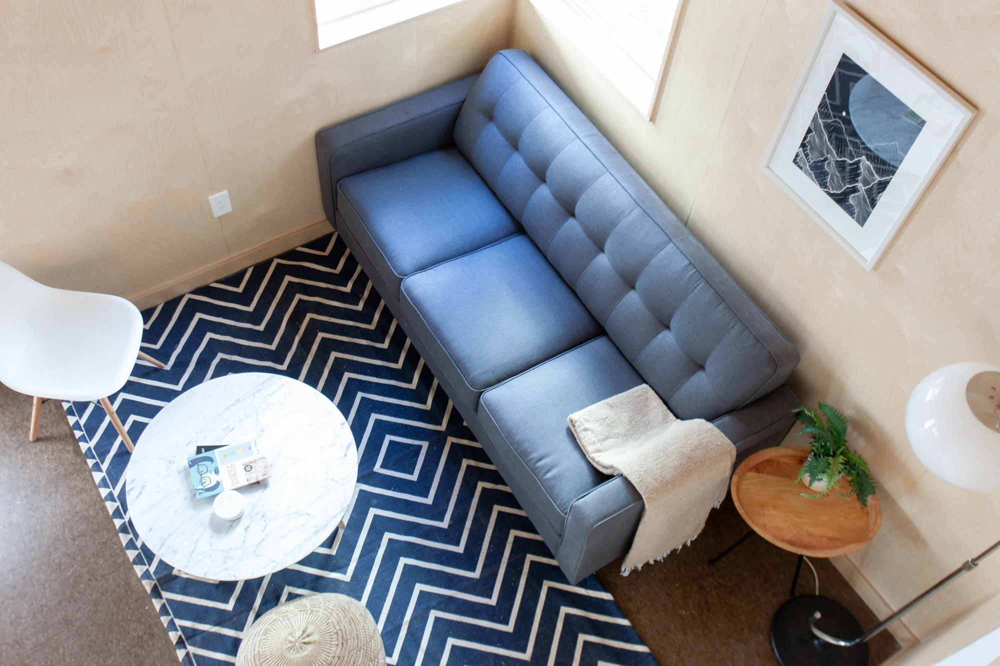 Sleep Inn / C2 cabin loft interior with blue couch at Colorado Lodge in Big Bear Lake