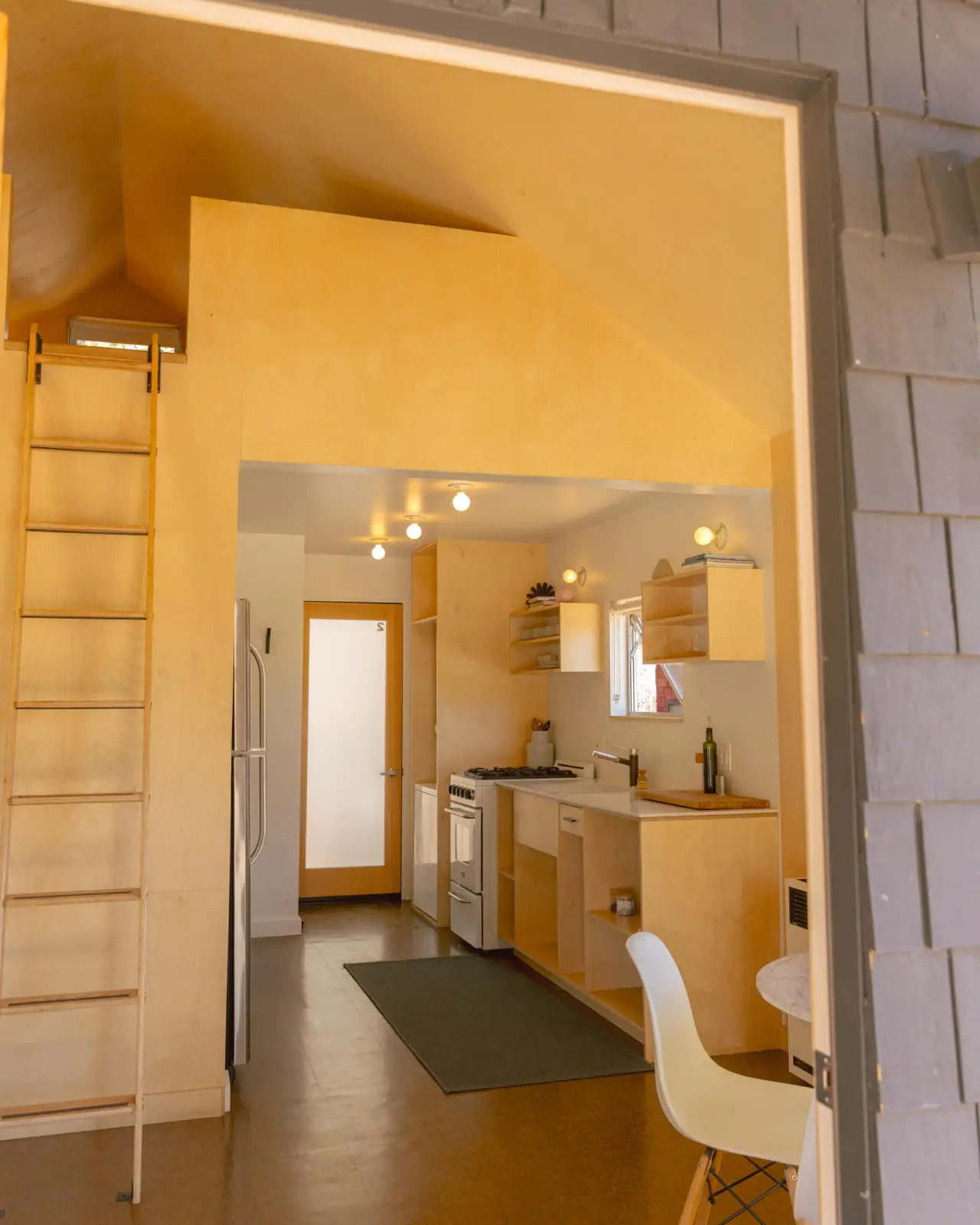 Sleep Inn / C2 full kitchen with warm lighting at Colorado Lodge boutique lodge Big Bear