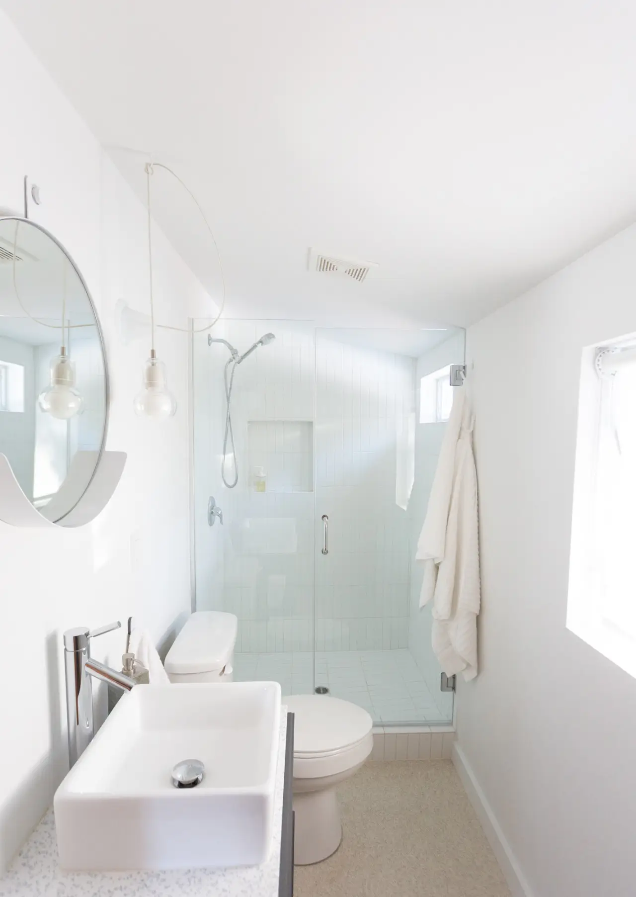 Small + Mighty / C5 bathroom with sink and tiled shower at Colorado Lodge Big Bear Lake