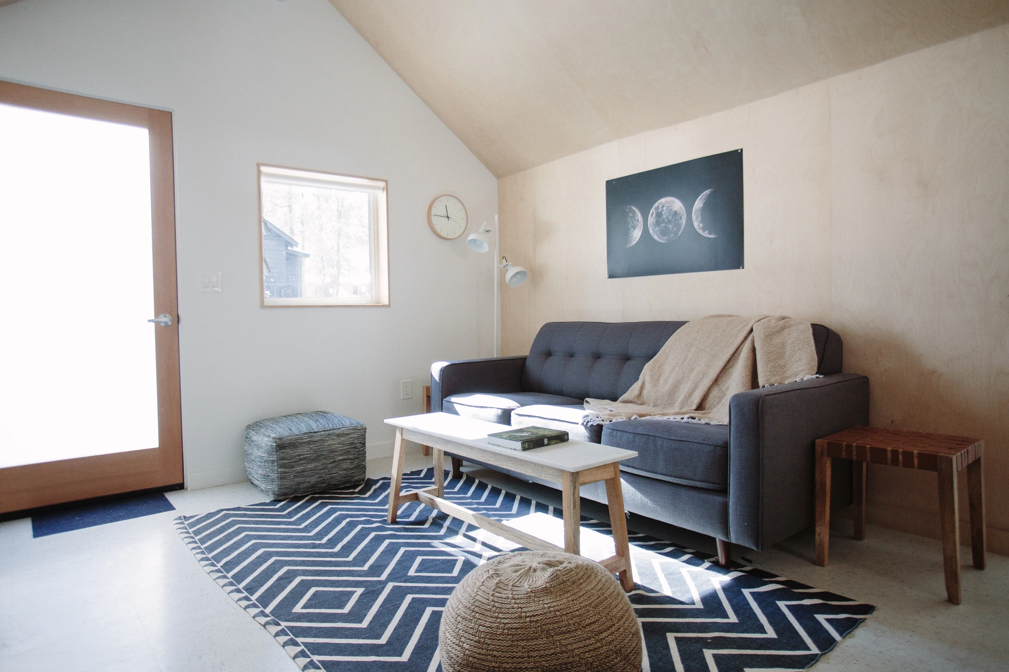 Cozy living room with blue couch in pet-friendly Big Bear cabin at Colorado Lodge