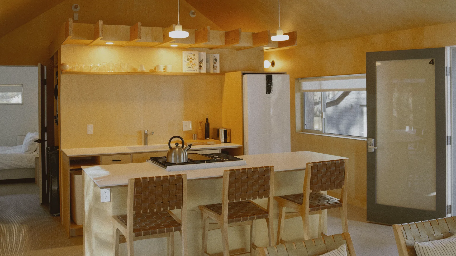 Modern Nordic-minimalist cabin interior at Colorado Lodge with warm wood tones and natural light