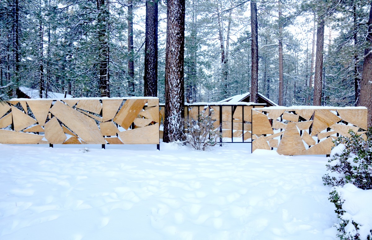 Snow covered geometric plywood fence by Terremoto Landscape at Colorado Lodge in Big Bear Lake, California